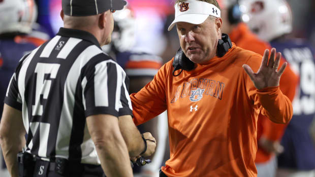 Nov 25, 2023; Auburn, Alabama, USA; Auburn Tigers head coach Hugh Freeze talks with game officials during a timeout in the third quarter against the Alabama Crimson Tide at Jordan-Hare Stadium.